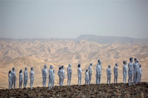 200 Israelis strip naked for photo shoot near the Dead Sea .